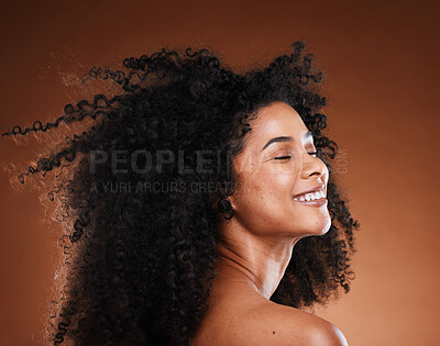 Buy stock photo Hair care, black woman and cosmetics with smile, happy and relax on brown studio background. Makeup, African American female or girl with afro, confidence or organic facial or face detox for skincare