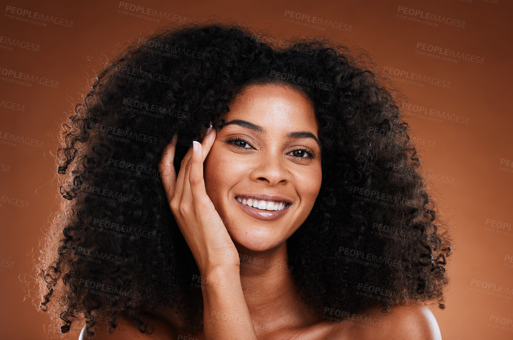Buy stock photo Wellness, skincare and hair care portrait of black woman with happy face touching texture. Health, beauty and natural african cosmetic model on brown studio background with beautiful smile.