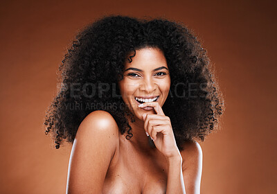 Buy stock photo Hair care, beauty and portrait of black woman with afro isolated in studio on brown background. Cosmetics, beauty salon and young female model with smile with healthy, shiny and natural curly hair