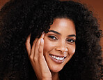 Face, beauty and skincare with a model black woman in studio on a brown background with afro hair. Portrait, haircare and cosmetics with an attractive young female posing to promote treatment