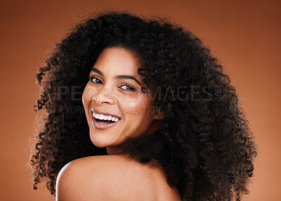 Buy stock photo Black woman, beauty and haircare with portrait for curly hair, hair care and hairstyle on a brown studio background. Afro, african american woman and hair style or hair care for health and hair