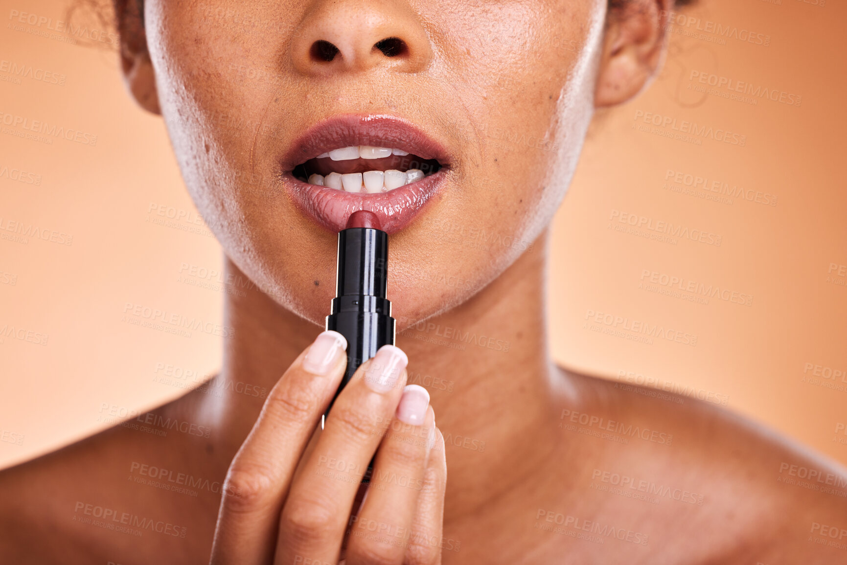 Buy stock photo Lipstick, black woman and cosmetics for skincare, natural beauty and wellness against brown studio background. Makeup, female and girl with lip gloss for soft lips, mouth and smooth facial for lady.