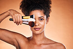 Beauty, makeup and portrait of black woman with brush for cosmetics, foundation application and skincare. Wellness, healthcare and aesthetic face of model with designer product for facial routine