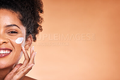 Buy stock photo Cream, black woman and skincare for natural beauty, wellness and body care with brown studio background. Cosmetics, African American female and girl with lotion, for smooth face and organic facial.
