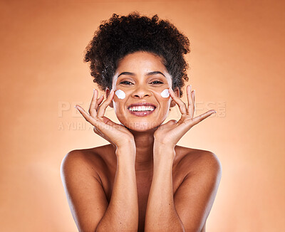 Buy stock photo Sunscreen, black woman with skincare product on face and beauty in studio with orange background in Atlanta. Healthy smile for portrait, collagen cream for facial glow or cosmetic lotion for acne