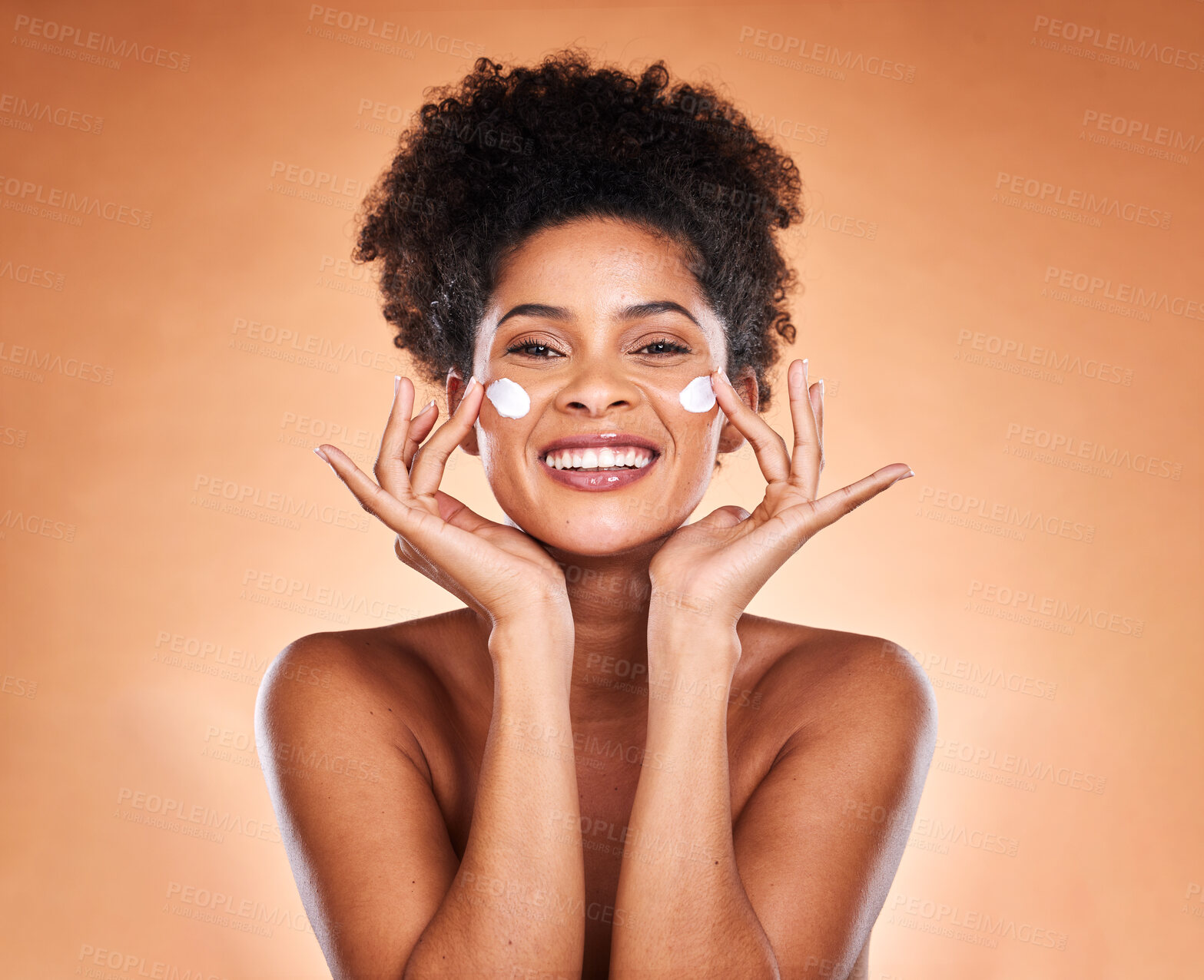 Buy stock photo Sunscreen, black woman with skincare product on face and beauty in studio with orange background in Atlanta. Healthy smile for portrait, collagen cream for facial glow or cosmetic lotion for acne