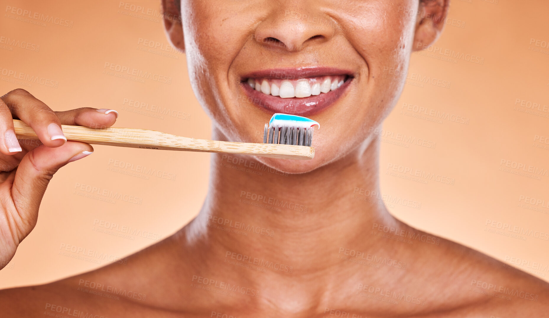 Buy stock photo Studio, dental and black woman brushing teeth on orange background. Wellness, oral health or routine of happy female model holding toothbrush and cleaning teeth for hygiene, oral care and dental care