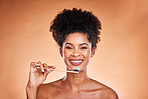 Black woman, portrait and toothbrush for cleaning, teeth and dental health or wellness on a brown studio background. Oral, health and brushing teeth with african american woman with oral hygiene