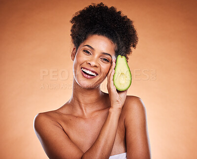Buy stock photo Beauty, skincare and black woman with avocado cosmetics health wellness product mockup on orange studio background. Portrait of health, clean vegetable diet and vegan lifestyle for natural skin glow 