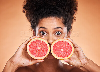Buy stock photo Black woman, skincare and grapefruit cosmetic for skin with vitamin c treatment, facial citrus health and natural wellness. Wow surprise eyes, healthcare model and healthy diet nutrition advertising 