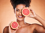 Grapefruit, skincare and black woman in studio portrait for beauty, cosmetics and vegan promotion, marketing or advertising. Healthy food, red fruits and face or headshot of model for vitamin c glow