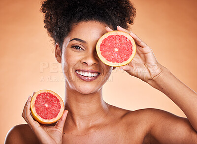 Buy stock photo Grapefruit, skincare and portrait of black woman with a beauty, organic and natural routine. Cosmetics, citrus fruit and African model with cosmetic facial treatment in studio with orange background.