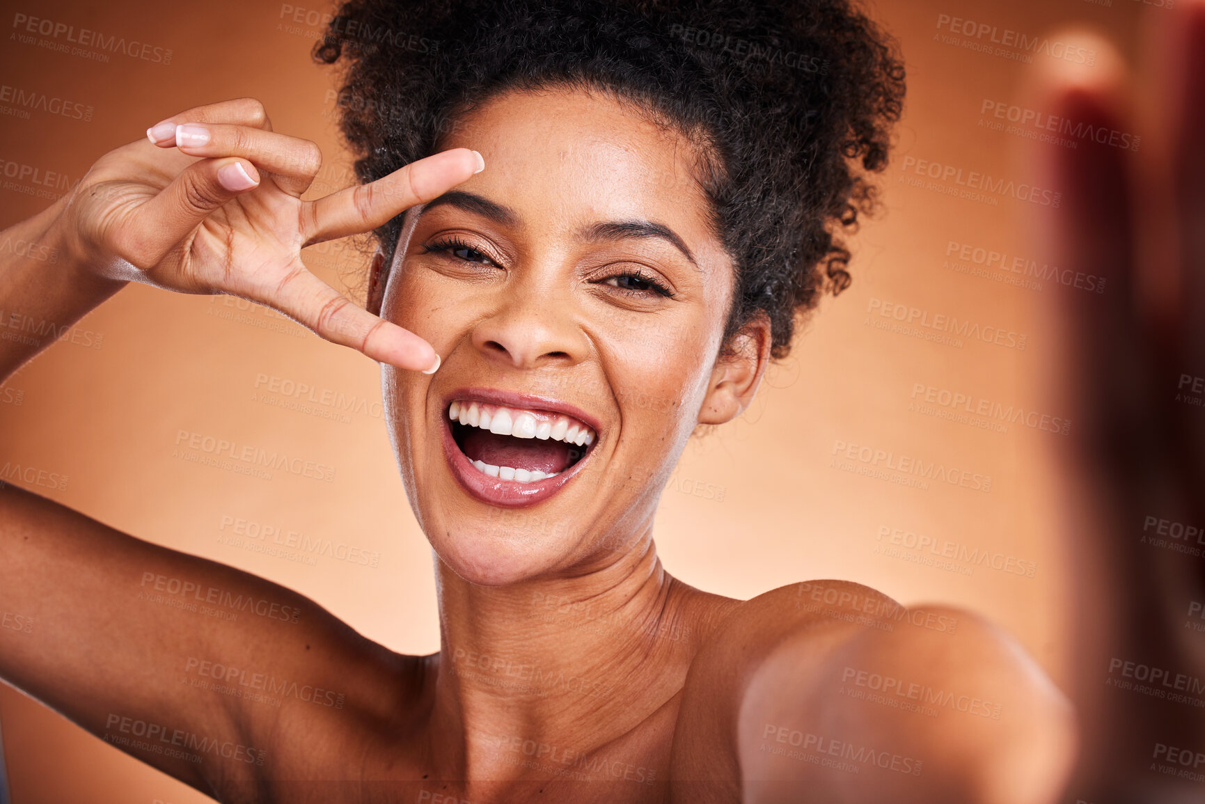 Buy stock photo Black woman, peace sign and skincare beauty, selfie for wellness and natural makeup or cosmetics in studio background. A happy model with afro, face cosmetic, hand icon and self love empowerment