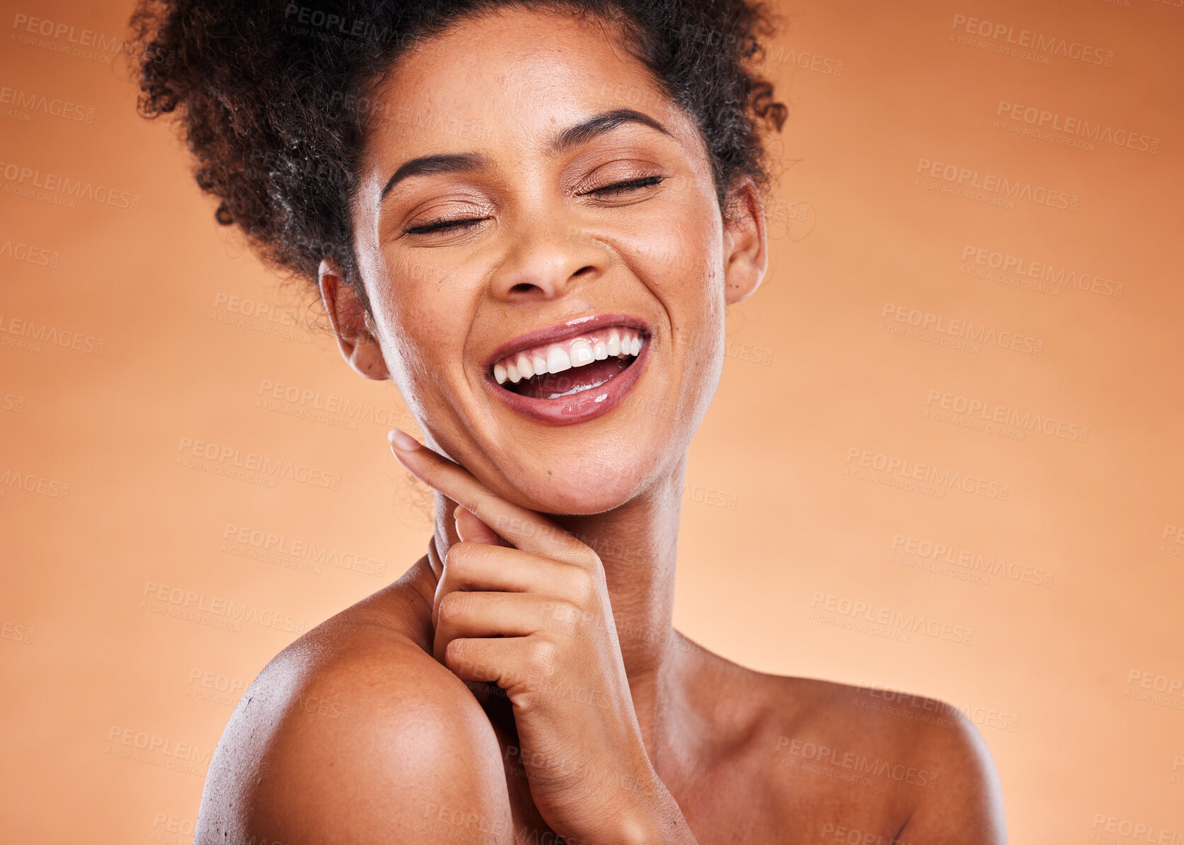 Buy stock photo Face, teeth and beauty of black woman with eyes closed in studio on an orange background. Skincare, cosmetics and natural makeup of happy female model laughing, smiling and carefree facial expression