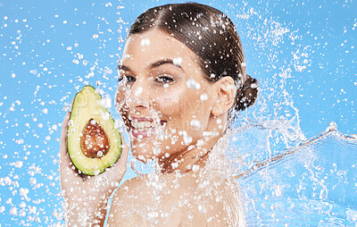 Buy stock photo Avocado, skincare and woman in studio portrait for healthy food, wellness and beauty vegan cosmetics promotion with water splash. Young model with natural skin care, nutrition diet green facial food