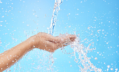 Buy stock photo Hands, water splash and cleaning skin, bacteria and hygiene for blue studio background with mockup space. Hand rinsing, washing or clean for fresh hygienic cleanse or hydration in care for skincare