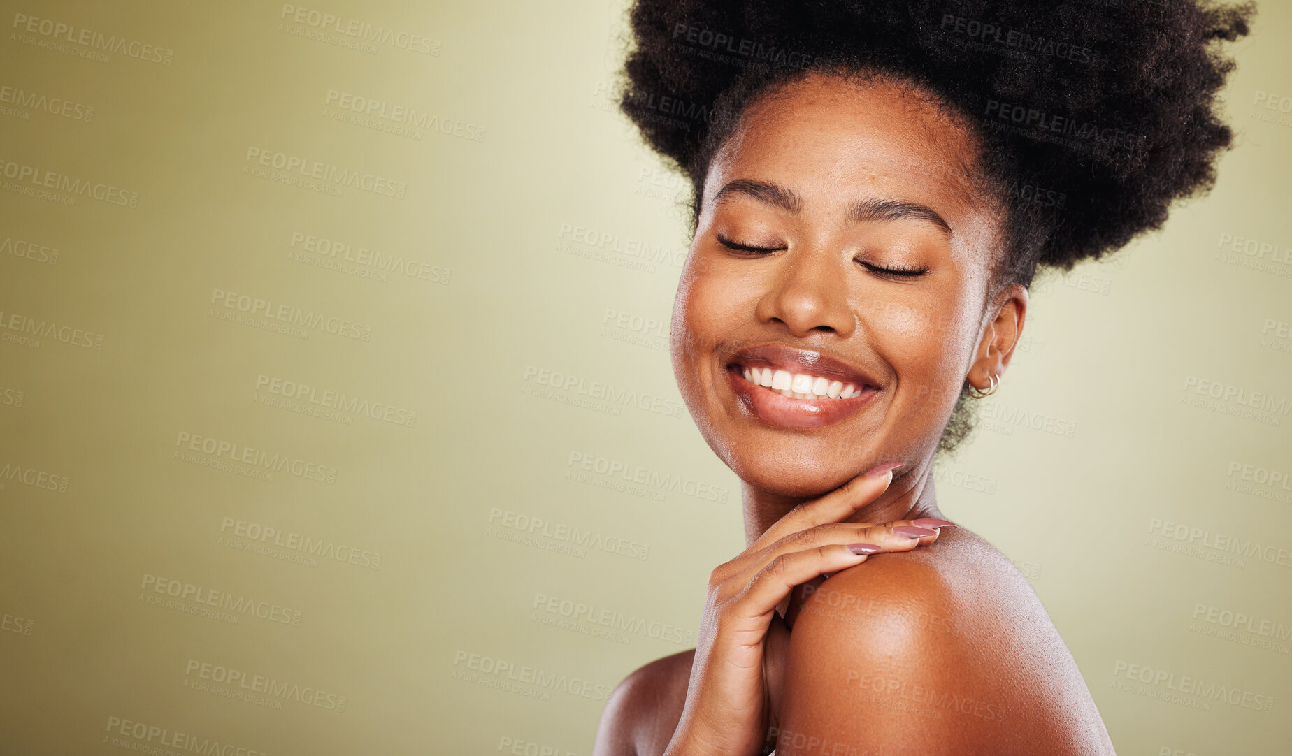 Buy stock photo Beauty, skincare and black woman in a studio for a natural face routine with mockup space. Happy, smile and African model with a smile doing a facial treatment by a green background with copy space.