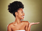 Black woman, skincare and hand open gesture in studio while happy, healthy and smile with radiant glow on skin. Model, girl and palm with happiness, cosmetics and makeup for wellness against backdrop