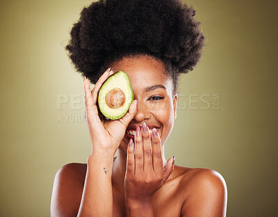 Buy stock photo Black woman, laughing or avocado skincare on green studio background for healthcare diet, dermatology wellness or nutrition. Portrait, smile or happy beauty model with fruit as organic facial product