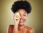 Avocado skincare, black woman and beauty, natural wellness, cosmetics and facial treatment, healthy diet and detox on studio background. Portrait of happy young model, organic food and dermatology 