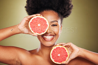 Buy stock photo Portrait, black woman and grapefruit for health, skincare and nutrition with smile, happiness and beauty. African, model and wellness woman with vitamin c fruit for skin, face and cosmetics in studio