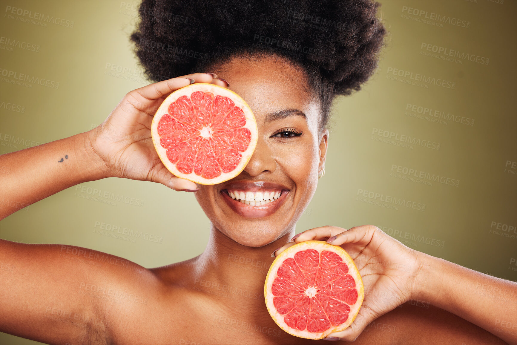 Buy stock photo Portrait, black woman and grapefruit for health, skincare and nutrition with smile, happiness and beauty. African, model and wellness woman with vitamin c fruit for skin, face and cosmetics in studio