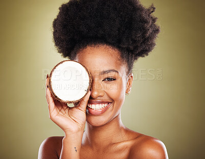 Buy stock photo Black woman, fruit and skincare beauty for cosmetics, moisturizer or nutrition against a studio background. Portrait of African American female holding coconut with smile for healthy facial treatment
