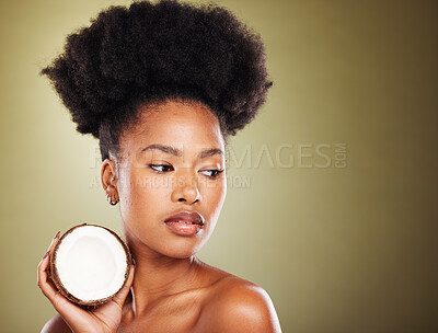 Buy stock photo Coconut, beauty and black woman in studio for natural hair care, skincare and healthy product marketing or advertising mockup. African model with coconut oil cream for skin care glow or hair growth