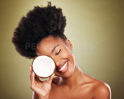 Buy stock photo Coconut, black woman and beauty for natural cosmetics,  healthy lifestyle and clean skincare on studio background. Happy african model, summer tropical fruit and nutrition, vegan diet and wellness 