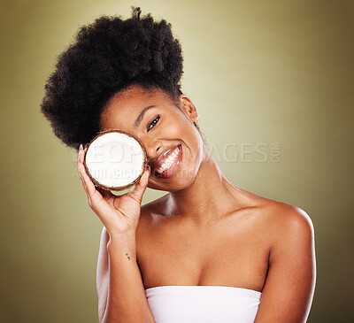 Buy stock photo Coconut oil, black woman and skincare, natural cosmetics and healthy lifestyle nutrition, antioxidant and beauty on studio background. Portrait happy african model, summer tropical fruit and wellness
