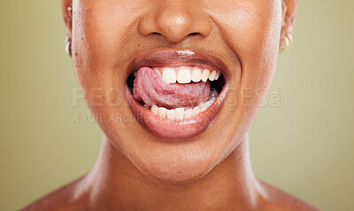 Buy stock photo Tongue, teeth and african woman in closeup with lick, smile or happy for dental wellness in studio. Model, mouth or perfect teeth whitening for health, medical or beauty by background in healthcare