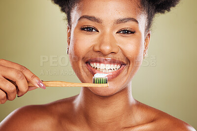 Buy stock photo Brushing teeth, black woman beauty and dental wellness, healthy lifestyle and cleaning cosmetics on studio background. Happy african model face portrait, toothpaste on toothbrush and mouth smile 