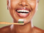 Black woman, toothbrush and closeup of teeth for dental, health or wellness of mouth in studio. Woman, beauty and self care model with toothpaste for healthy smile, happy or zoom on face for cleaning