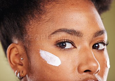 Buy stock photo Black woman, eyes and cream for skincare cosmetics, makeup or lotion against a studio background. Closeup portrait of African American female face with moisturizer creme for facial cosmetic treatment