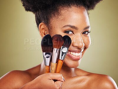 Buy stock photo Black woman, face and brushes for makeup cosmetics, facial skincare and product on studio background. Zoom, smile portrait and happy beauty model brush, powder foundation or dermatology wellness