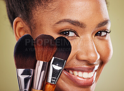 Buy stock photo Brushes, makeup or black woman model in studio for beauty, foundation application or cosmetics facial products. Health, wellness or happy African girl for aesthetic face, smile or luxury skincare