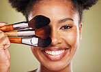 Black woman, makeup brush and smile in studio for beauty portrait, wellness and cosmetics by backdrop. African woman, model and face with cosmetic tools, hand or happy for skincare by background