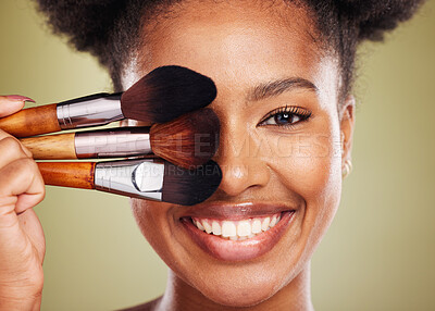 Buy stock photo Black woman, makeup brush and smile in studio for beauty portrait, wellness and cosmetics by backdrop. African woman, model and face with cosmetic tools, hand or happy for skincare by background