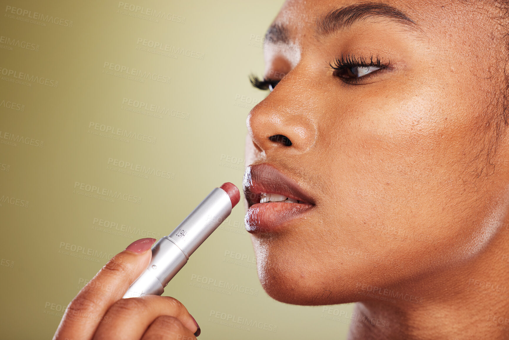 Buy stock photo Lipstick, black woman and skincare for wellness, cosmetics, smooth lips or against brown studio background. Makeup, African American female or girl with lip balm, for gloss or soft for natural beauty