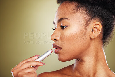 Buy stock photo Lipstick, beauty and black woman with studio mockup for cosmetics, makeup and face marketing, advertising or promotion space. Young skincare model with lips color product cosmetic on green background