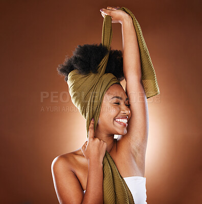 Buy stock photo Beauty, face and black woman with hair scarf in studio on brown background mockup. Hair care, wellness or happy female model with eyes closed and fabric head wrap for afro hair or unique hair style

