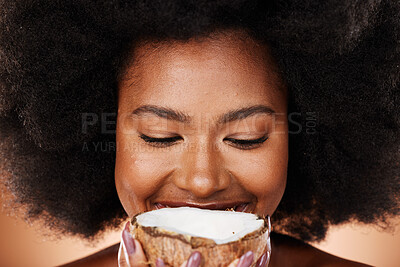 Buy stock photo Closeup beauty, coconut and black woman in studio with skincare, healthy glow and smile on face. African, model and natural makeup with fruit for cosmetics, wellness or health with hair by background