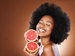 Black woman, afro hair or grapefruit for face skincare, healthcare wellness glow or vitamin c dermatology routine. Smile, happy or beauty model with natural hair, citrus food or vegan facial product