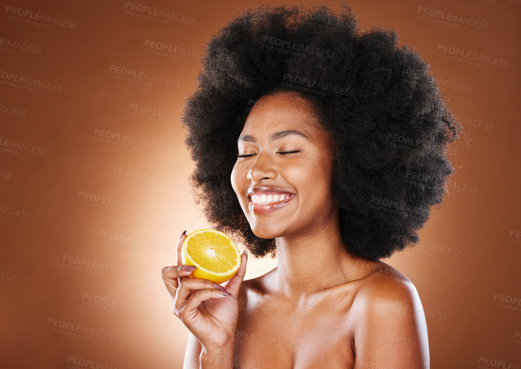 Buy stock photo Orange, black woman and vitamin c beauty, skincare and wellness, healthy food or detox diet, natural cosmetics and afro on studio background. Happy young vegan model eating citrus fruit for nutrition