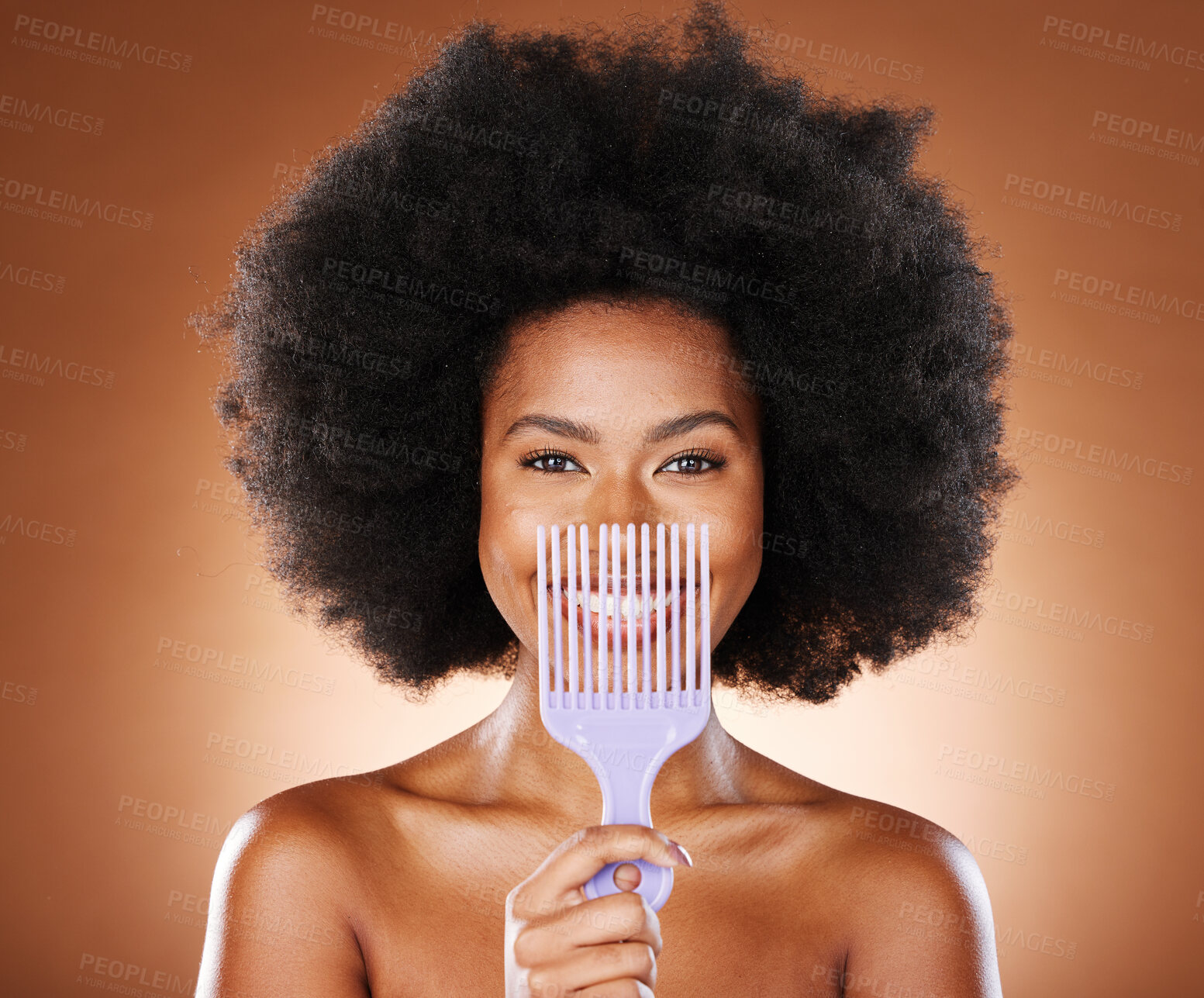 Buy stock photo Black woman afro, comb and smile for hair care, style or fashion against a studio background. Portrait of African American female smiling in satisfaction for beauty hairstyle or salon treatment