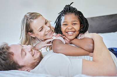 Buy stock photo Love, adoption and family portrait, relax and smile on bed in home, happy and support with care. Mother, father and black girl, happiness and freedom in bedroom relaxing, smiling and family home