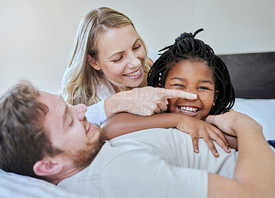 Buy stock photo Black girl, child or parents bonding on bed in house, home or hotel in fun game or activity. Smile, happy or laughing kid with mother, father with foster or interracial family in relax bedroom