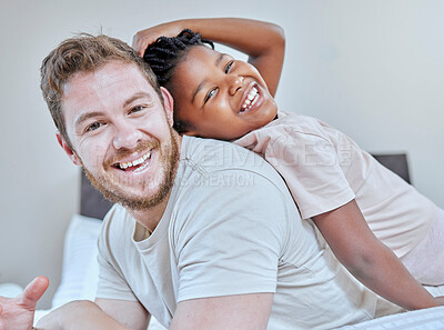 Buy stock photo Interracial, father and daughter in bedroom portrait, happy or smile back touch for bonding. Diversity, multicultural family and girl with dad, adoption and bed with laugh, play or comic time in home