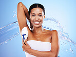 Armpit shaving, black woman and hair removal, water splash or skincare, clean body and wellness, personal hygiene and beauty cosmetics on blue background. Portrait lady, shave underarm and cream foam