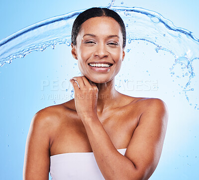 Buy stock photo Black woman, water splash and shower with smile, cleaning body and skin hydration for wellness in blue studio background. Female model fresh and healthy skincare with treatment and healthy cosmetic